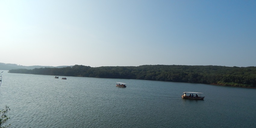 An image of Venna Lake, a lake in Maharashtra, with calm waters surrounded by lush greenery.