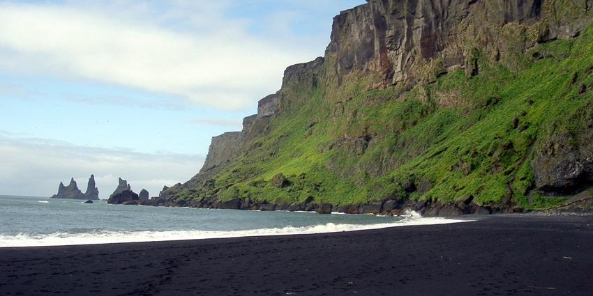 Vik Beach in Iceland, is one of the stunning black sand beaches in the world, with basalt cliffs.