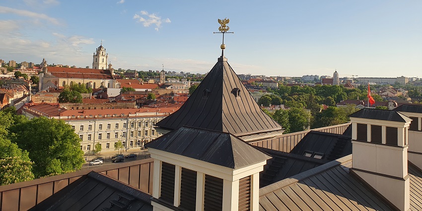 Scenic view of Vilnius Old Town with red rooftops and historic architecture in daylight