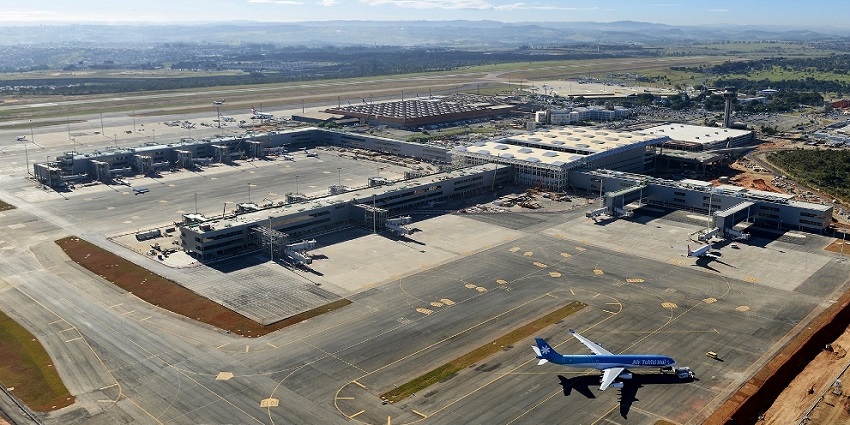 Campinas Airport terminal with parked planes, runway, and surrounding infrastructure.