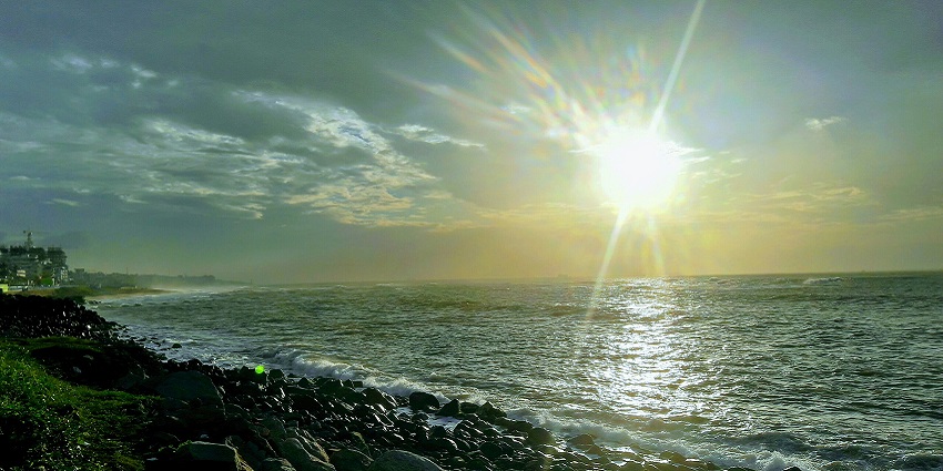 Sharp sunlight lits the rocky shores of one of the Visakhapatnam beaches in Andhra Pradesh.