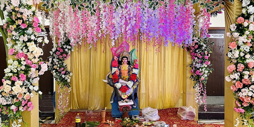 An image of the Vishwakarma Puja celebration featuring tools, offerings and decorations