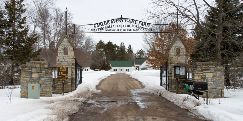 Entrance to the Carlos Avery Wildlife Management Area with multiple sign boards, one of the things to do in Forest lake.