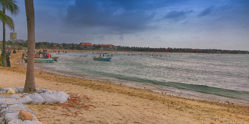 Enjoy the serene atmosphere and the gentle waves of the Pasikudah Beach in Sri Lanka
