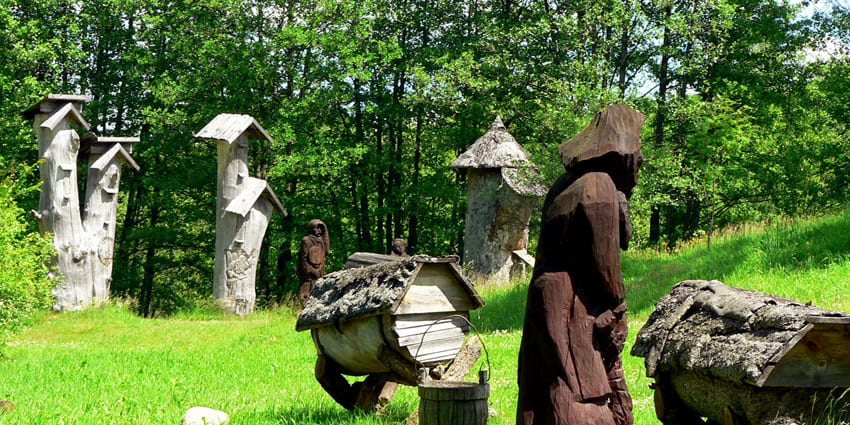 Traditional wooden beehives at the Lithuanian Museum of Ancient Beekeeping in Aukštaitija.