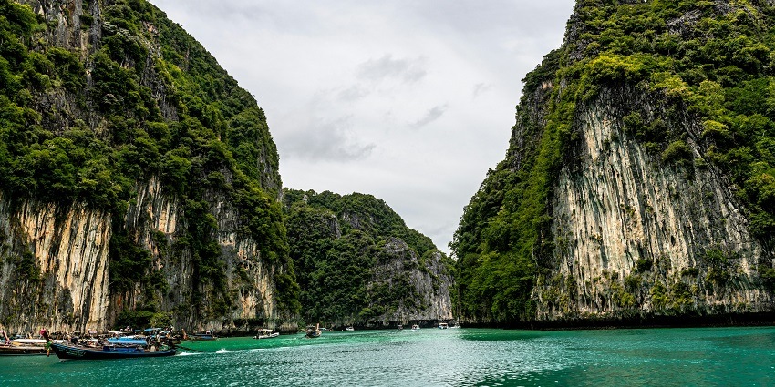 Tranquil Hidden Lagoon with crystal-clear waters, lush greenery, and serene reflections near Railay Viewpoint.