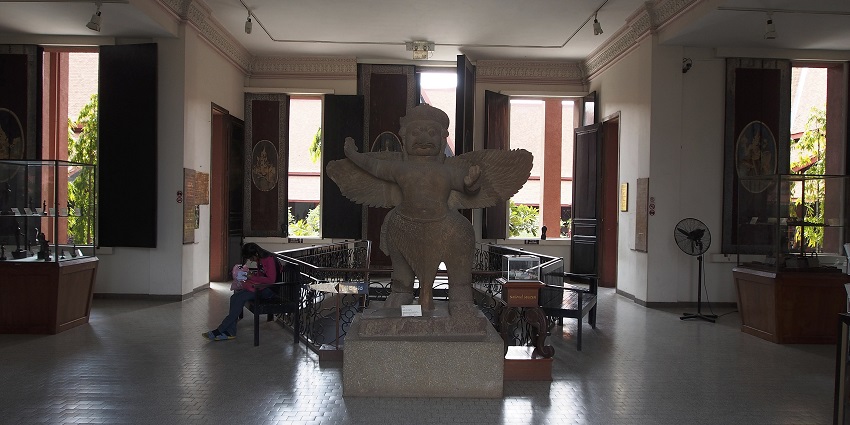 An ornate statue with wings, played centrally in the National Museum of Cambodia