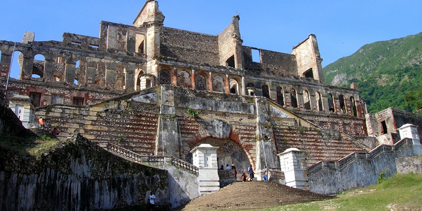 An image of the historic ruins of Sans-Souci Palace, surrounded by lush greenery, is one of the top things to do in Haiti.