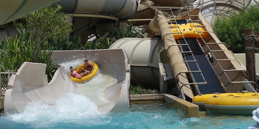 Image of a waterpark with water slides in yellow colour - enjoy at Wild Wadi Waterpark