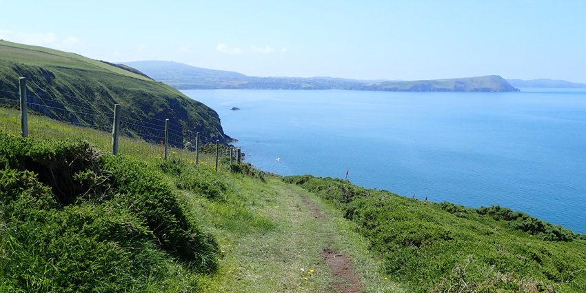 Scenic coastal cliffs in Wales, UK offer stunning rock climbing routes for all levels