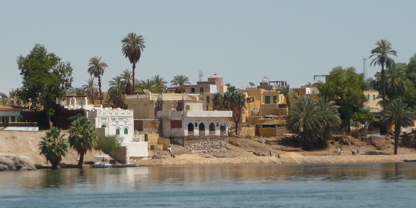 An image of a Nubian village on Elephantine Island, Egypt, with colorful houses, showcasing things to do in Aswan.