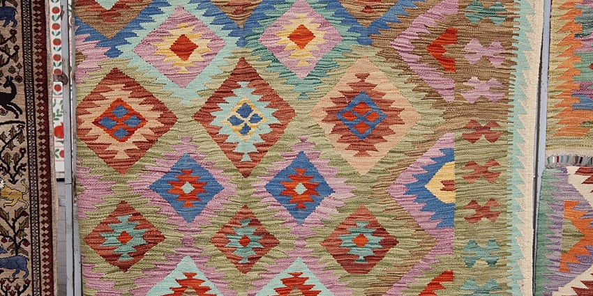 An Image of a hand woven carpet, similar to the carpets made in the Wangmo Hand-Woven Carpet Factory