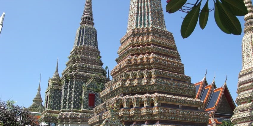 Visit the famous Wat Pho, home to the giant reclining Buddha statue in Bangkok