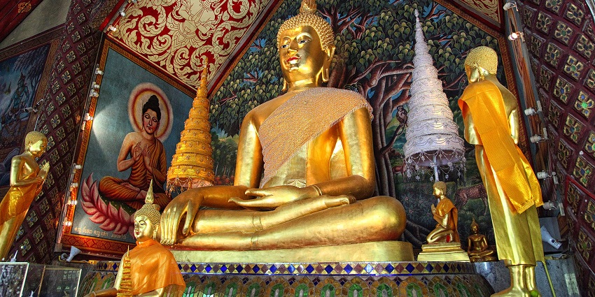 View of the Buddha statue in Wat Suan Dok, highlighting its detailed craftsmanship.