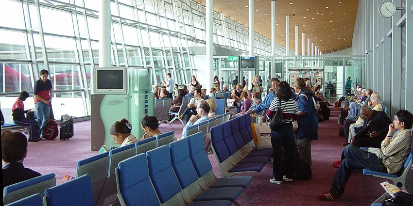 Watch movies at the movie lounge, a great way to pass time at Kuala Lumpur Airport.