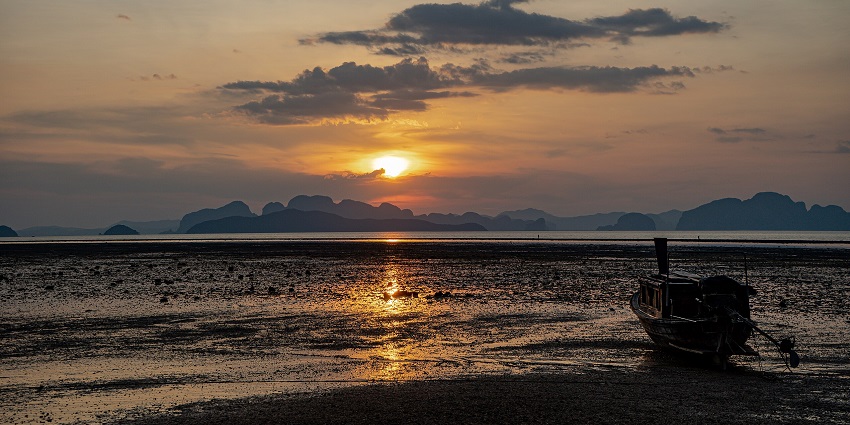 The sunset at Railay Beach paints the sky in vibrant hues, a perfect way to end the day.