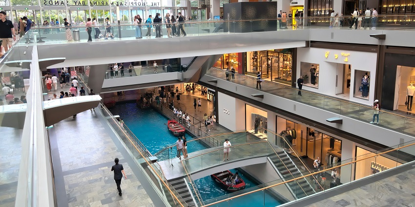 View of visitors strolling through the shops inside the mall, an ideal retail therapy experience