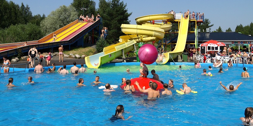 Visitors enjoy leisure time in swimming pools at a top water park in West Bengal.