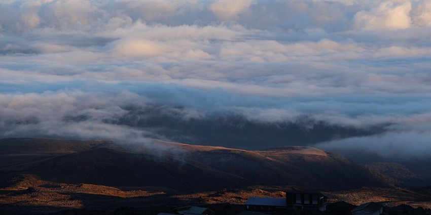 A view of Whakapapa Village with ski fields and walking trails near Tawhai Falls, New Zealand.