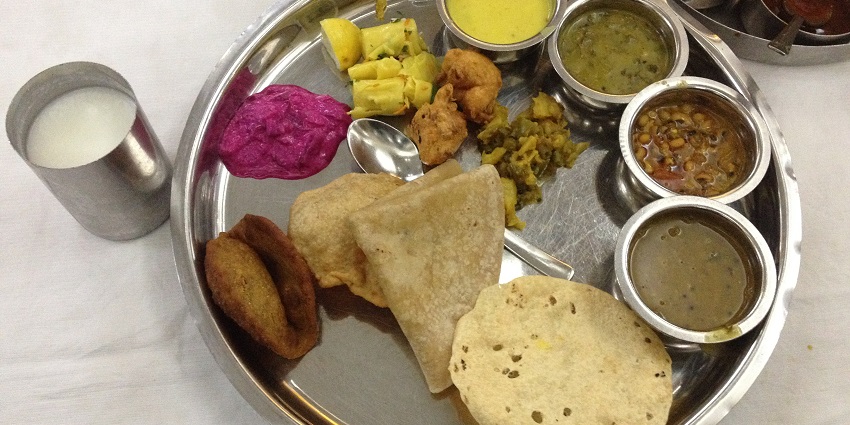 An image of tasty traditional Maharashtrian food thali prepared at a restaurant.