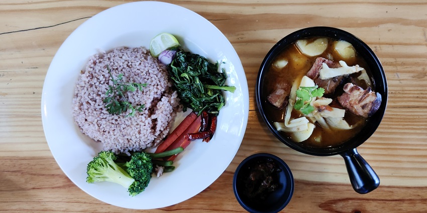 Naga-style smoked pork ribs served with rice, roasted vegetables and bamboo shoots.