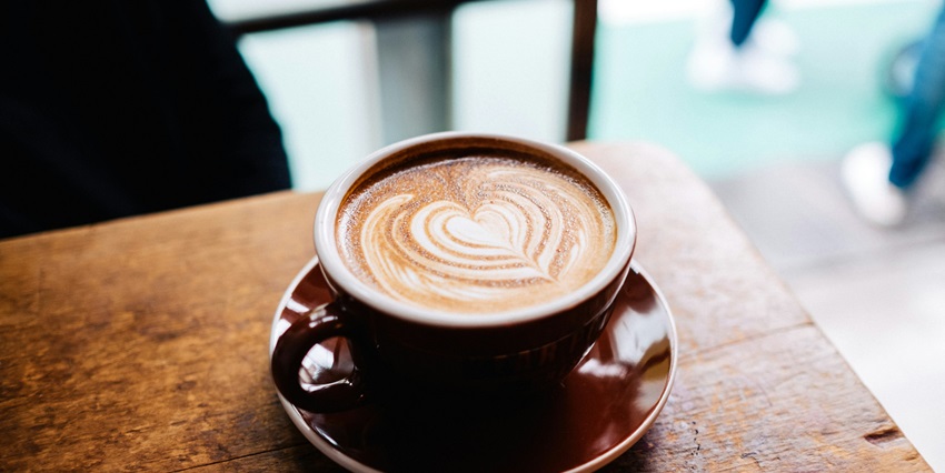 A warm cup of coffee in a brown mug is perfect for a cosy and relaxing moment.
