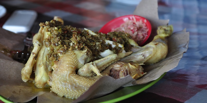 Spicy and flavourful Balinese Ayam Betutu, a slow-cooked chicken dish wrapped in rich aromatic spices.