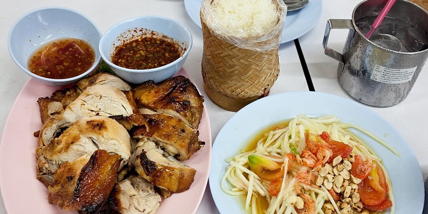 Som Tam, Kai Yang, and Khao Niaow – a beloved Isarn dish trio popular across Thailand.