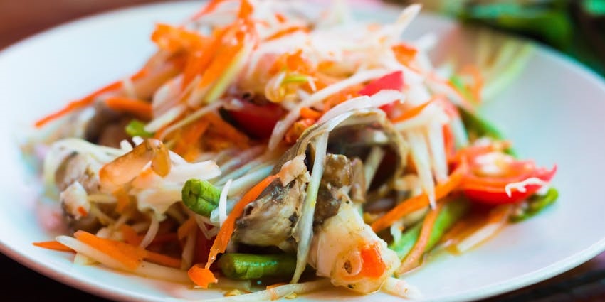 Enjoy Thai cuisine in Krabi Town or beachfront dining in Ao Nang near Tiger Cave Temple.