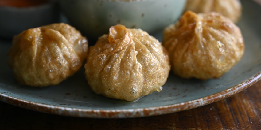 An image showing fried momos, a part of Tibetan cuisine.