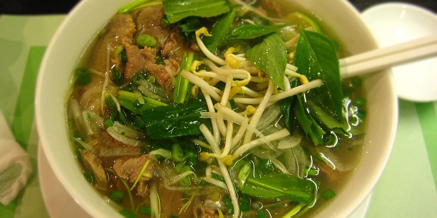 A delicious bowl of Pho, Vietnam's famous noodle soup, served in a local eatery