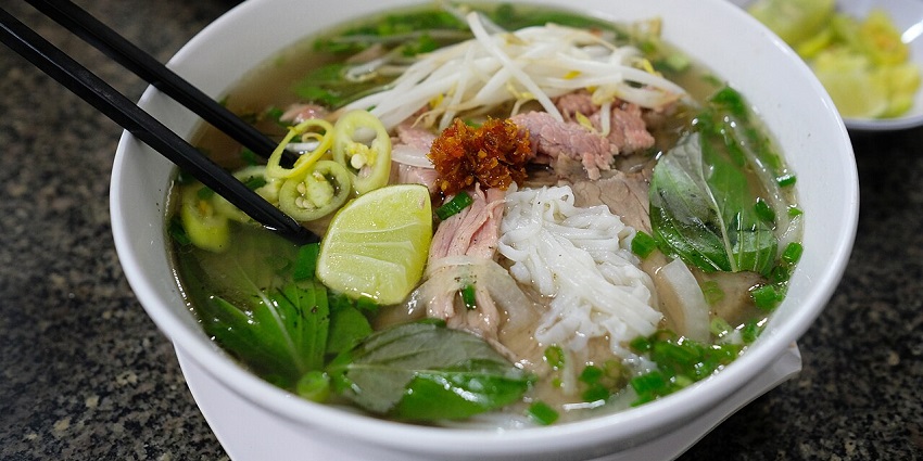 Image of a bowl of Pho served on a white bowl in a restaurant of Sapa in Vietnam