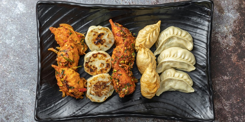 There are many eateries near Garden of Dreams offering delicacies including momos.
