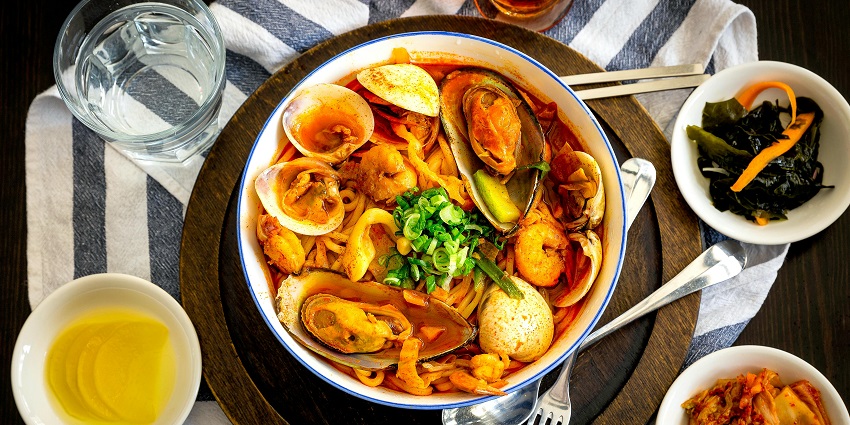 An image of fresh seafood, showcasing a variety of fish, shellfish, and crustaceans on display.