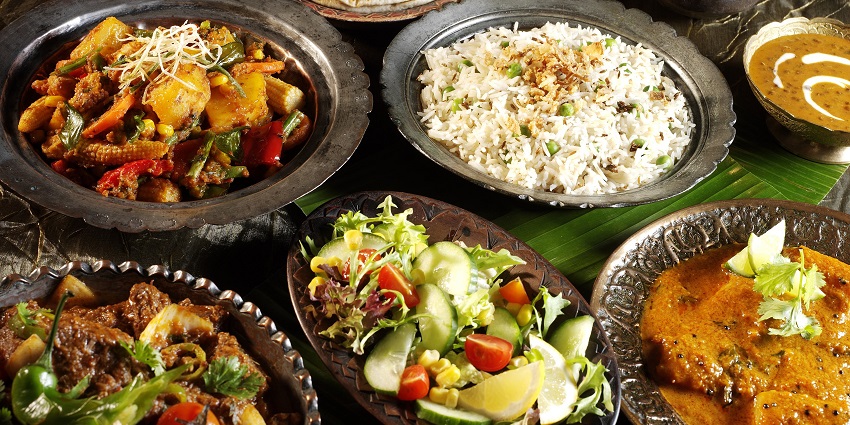 An image of tasty Indian food, featuring a variety of dishes with rich spices and delicious flavours.