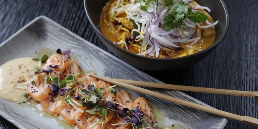 Savor diverse cuisines near Dubai Miracle Garden, from steaks to seafood