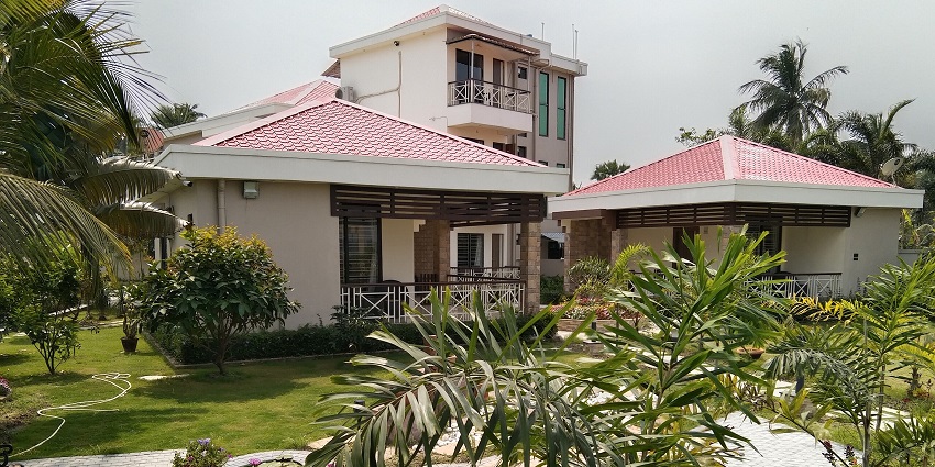 Pool at a resort to stay with all the required facilities amidst a serene background.