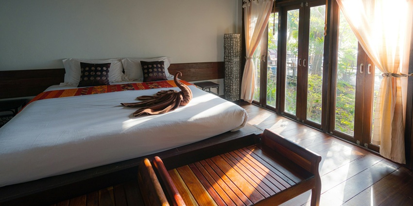Image of a hotel room with beautiful views from the window and door
