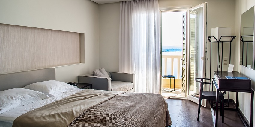 A modern hotel room with cosy bedding, perfect for relaxing during travel or vacation stays