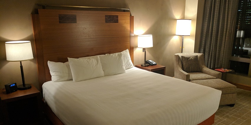 Image of a comfortable stay in a hotel with a cost bed white sheets and clear room
