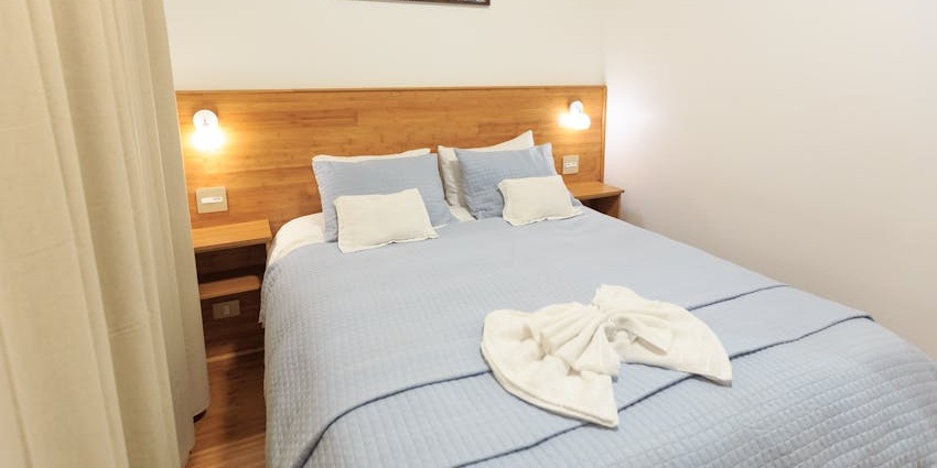 A man opens the door of a room in a budget-friendly hotel in Bogamati, Baksa