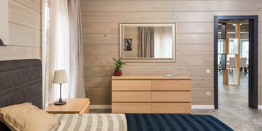 Image of a hotel bed room with modern and aesthetic furnitures and clean area