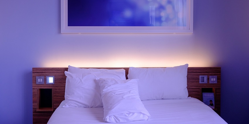 Image showing a hotel bedroom featuring contemporary furniture and a comfortable bed.