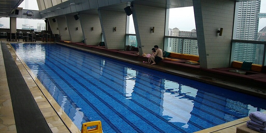 An attractive view of the interior, the pool-side of a gorgeous Kuala Lumpur luxury hotel.