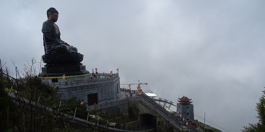 Panoramic view of Fansipan Mountain, shrouded in mist and greenery