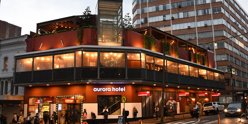 Stunning view of Aurora Hotel, Elizabeth Street, Sydney, at dusk.