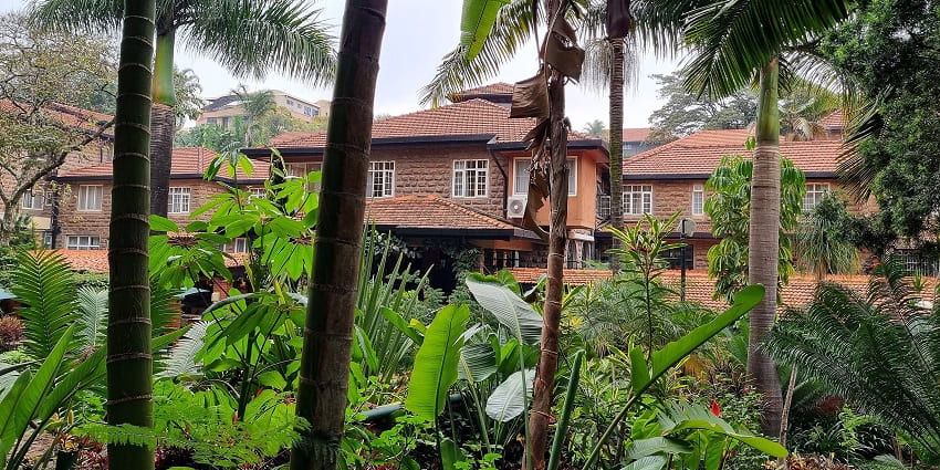 Front view of Fairview Hotel, featuring elegant architecture and lush green surroundings