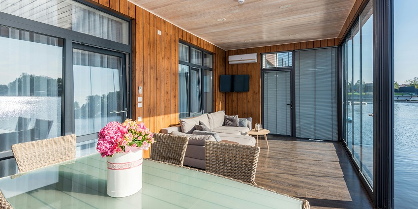 An image of a lakeside cottage with stunning views of a lake, similar to the Wular Lake