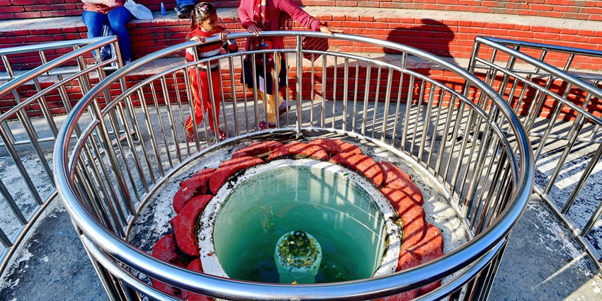 Explore the Wishing Pond in Davis Fall where visitors toss coins for luck.