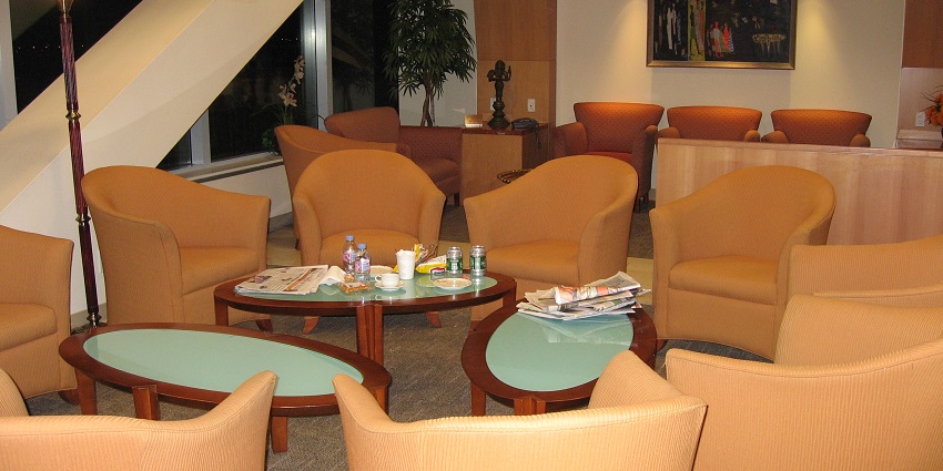An image of a lounge with comfortable seating, buffet dining, and relaxing ambience